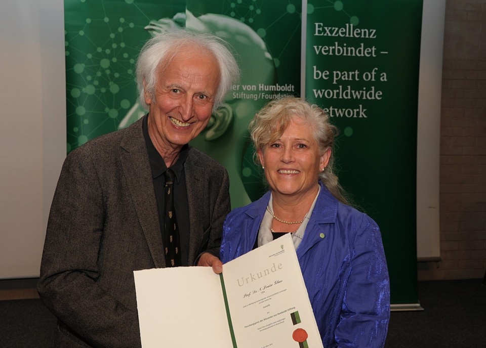 Glass, right, receiving her award from Professor Helmut Schwarz, President of the Humboldt Foundation. (photo courtesy of Humboldt Foundation)