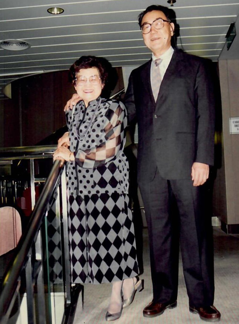 Two people standing on a stairway