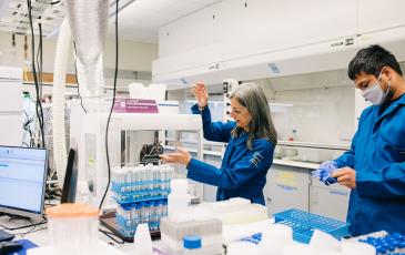 Image of Sabeeha Merchant and student in a laboratory 