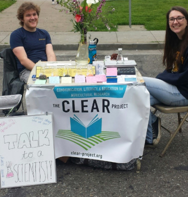 Students Tim Jeffers and Tuesday Simmons are ready to answer the public’s science questions at the downtown Berkeley farmers market.